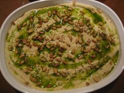 http://www.gourmetproject.ca/wp-content/uploads/2007/07/46-hummus-with-toasted-pine-nuts-cumin-seeds-and-parsley-oil-p-14-small.JPG
